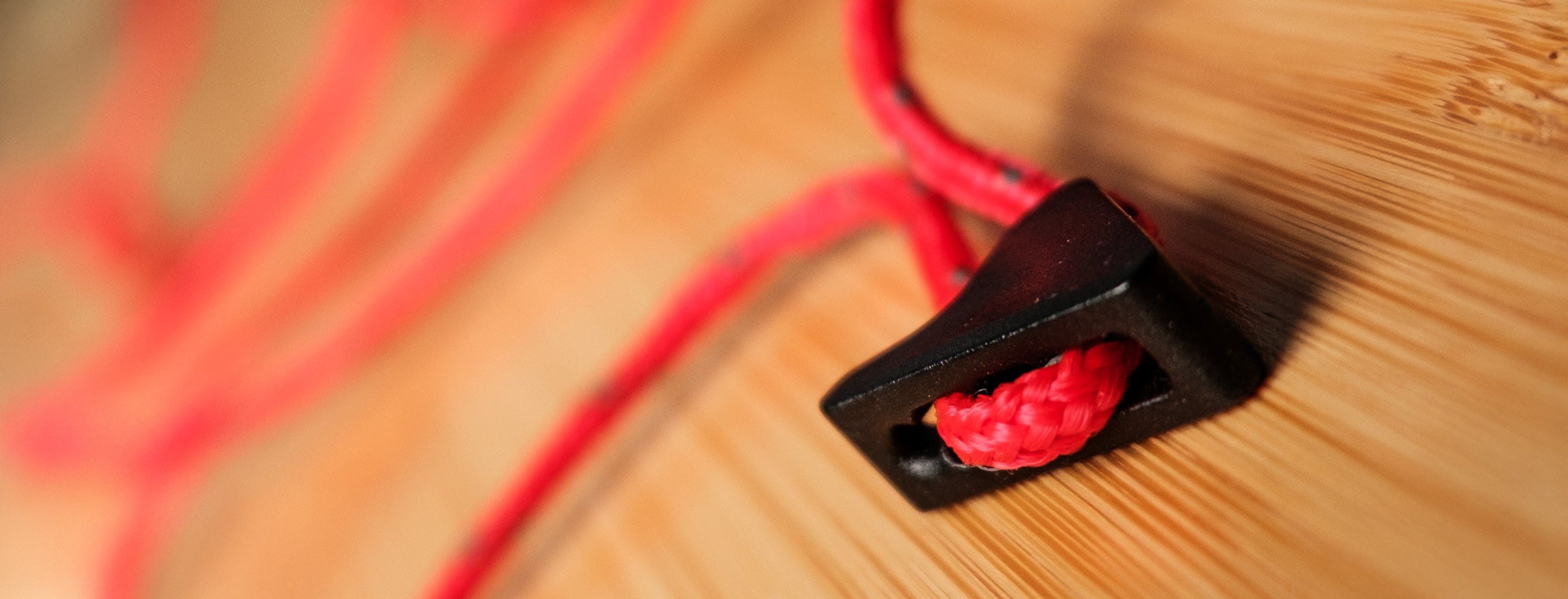 red guy rope on a wooden table